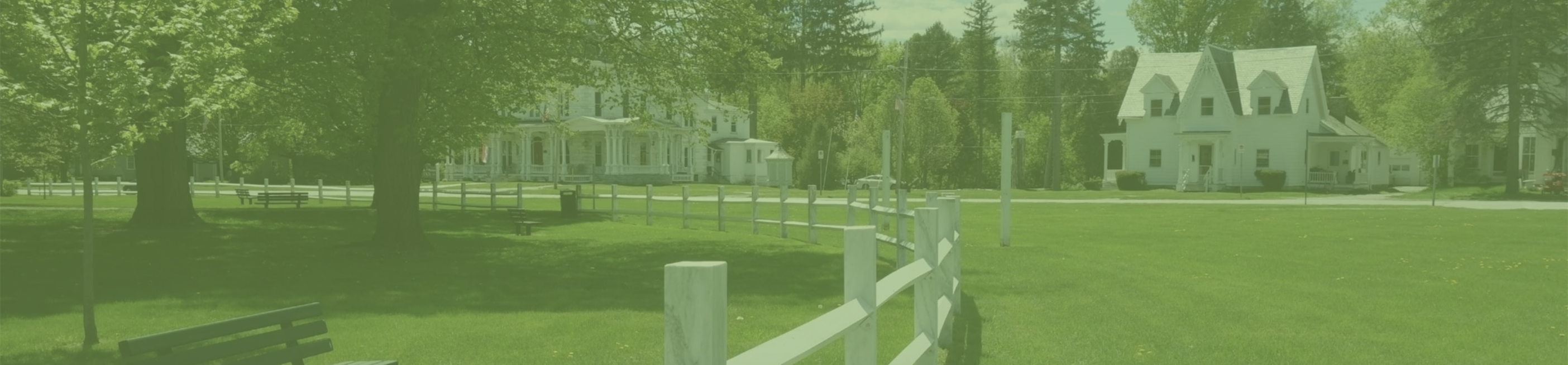 Vermont green landscape with white fence